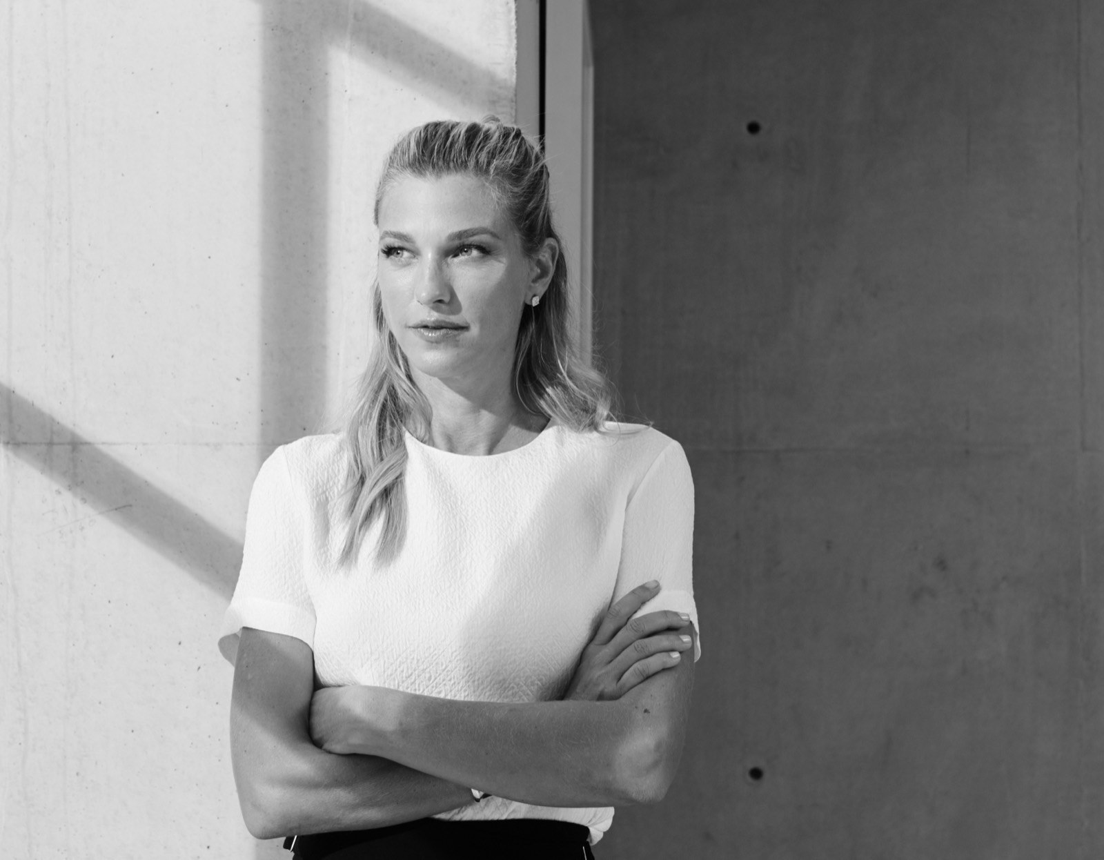Nicole Junkerman in a cream blazer, a relaxed editorial portrait.